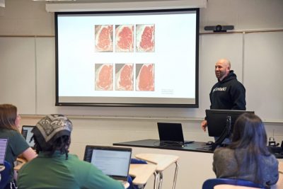Joe Emenheiser of the Department of Animal Science and UConn Extension in the College of Agriculture, Health and Natural Resources teaches Livestock and Carcass Evaluation (ANSC 3674) in a classroom in the George C. White Building (WITE). Apr. 10, 2023. (Jason Sheldon/UConn Photo)